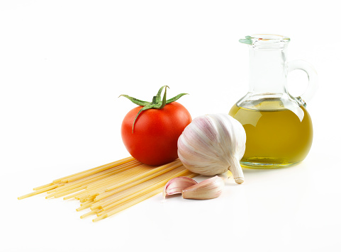 pasta,tomato oil, and garlic on white background 