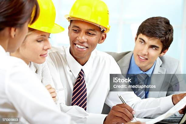 Architects At Meeting Stock Photo - Download Image Now - 25-29 Years, Adult, Adults Only