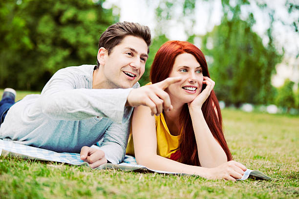 istock Young Couple Relaxing In Park 171301878