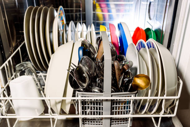 istock Clean dishes and cutlery inside a dishwasher at home. 1713022784