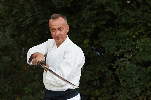 ki aikido  fight katana master man sport martial art nature practice training pose kimono