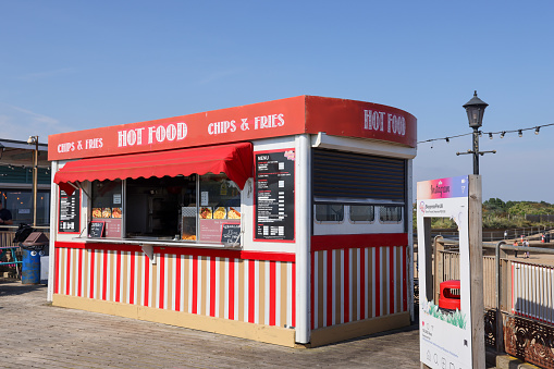 Skegness, Lincolnshire, England - September 16, 2023: A hot food cabin on the pier at the East Coast seaside town of Skegness