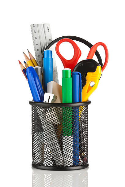 istock Desk organizer filled with some school supplies on white backdrop 171302715