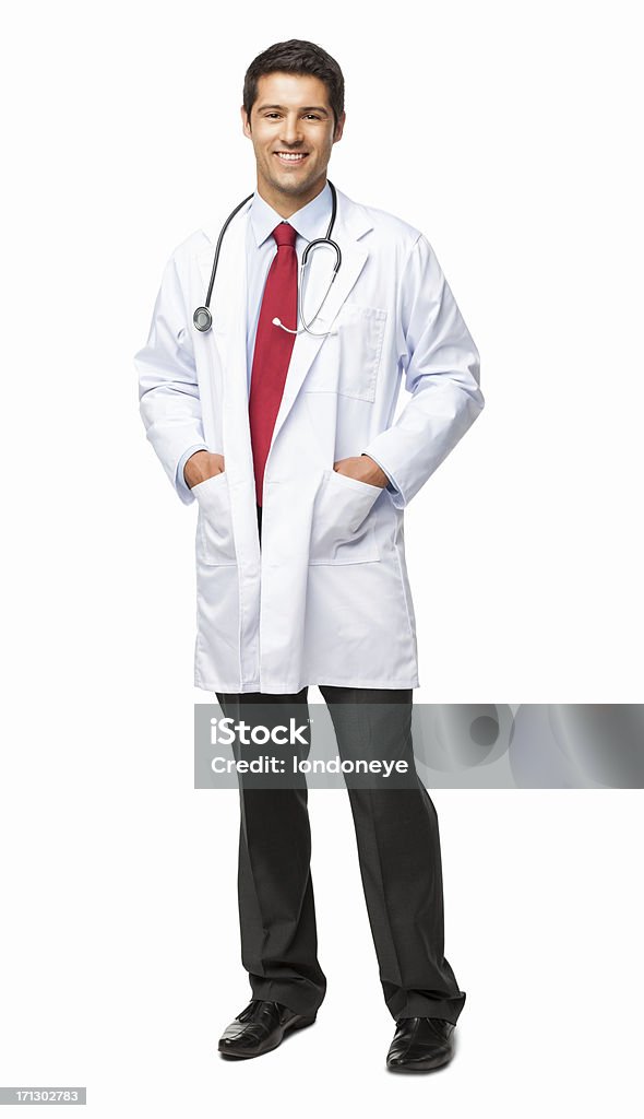 Happy Young Doctor - Isolated Full length portrait of a happy young male doctor in lab coat standing with hands in pockets. Vertical shot. Isolated on white. Doctor Stock Photo