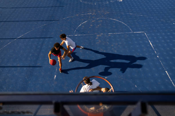 istock Male friends playing basketball 1713028566