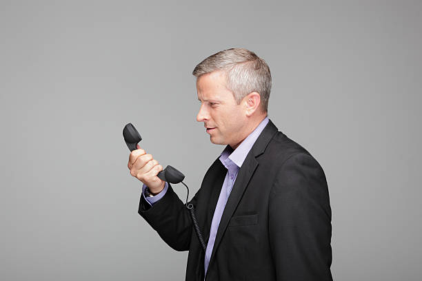 istock Business Man with old style phone 171302994
