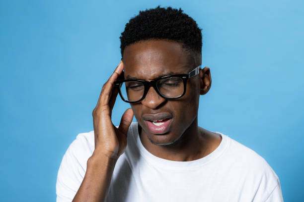 istock Young sad handsome ill sick african american man having headache isolated on grey 1713030450