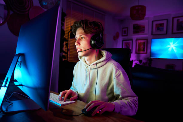 istock Caucasian man playing game at night among neon lightning 1713037674