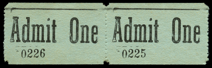 green vintage admission ticket stubs against black