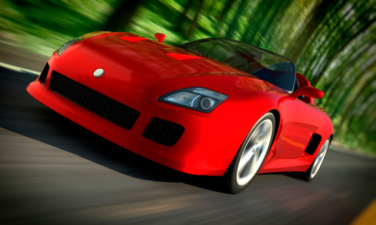 Sports car driving fast in forest