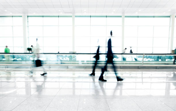 People walking in airport People on walk stand in airport travolator stock pictures, royalty-free photos & images