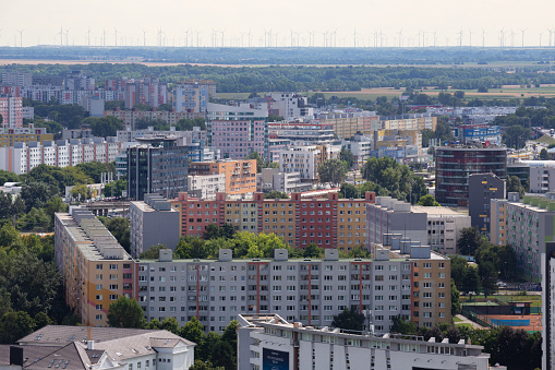 Bratislava, Slovakia - July 31th 2023 : Bratislava Petrzalka with austrian wind turbines in background