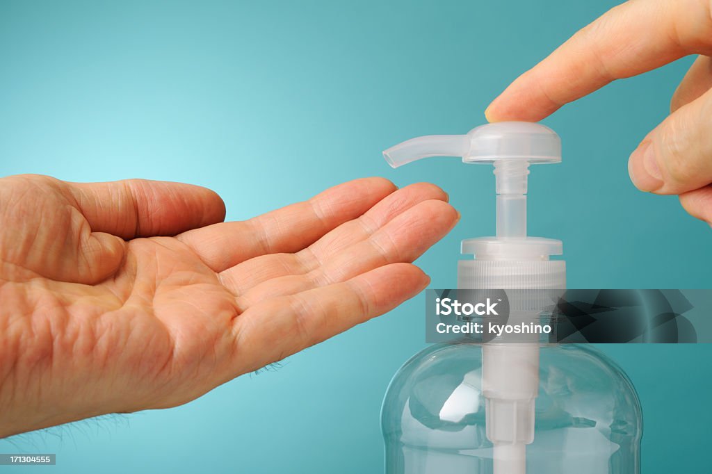 Dedo impulsiona o de sabão líquido contra Fundo azul - Foto de stock de Anti-higiênico royalty-free