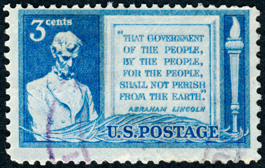 Cancelled Stamp From The United States Featuring A Quote From The American President Abraham Lincoln