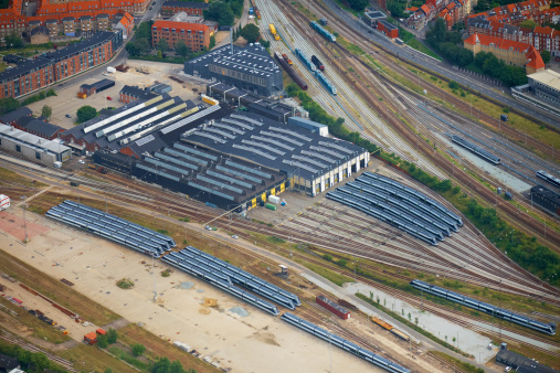 Aerial view of lots of trains waiting for service prior to use.