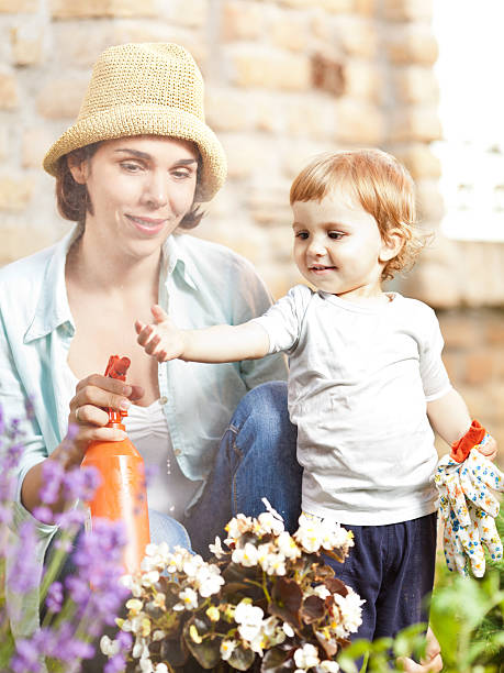 istock Little boy gardening with his mommy 171305079