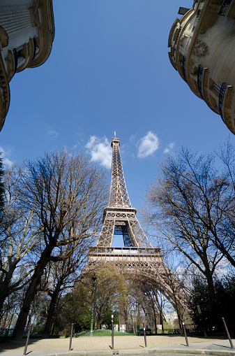 Eiffel tower  between buildings in Paris, France