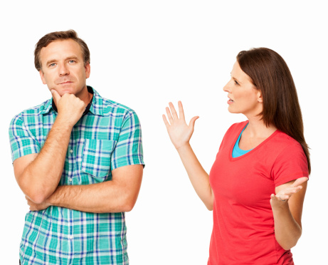 Mature woman arguing with her husband. Horizontal shot. Isolated on white.