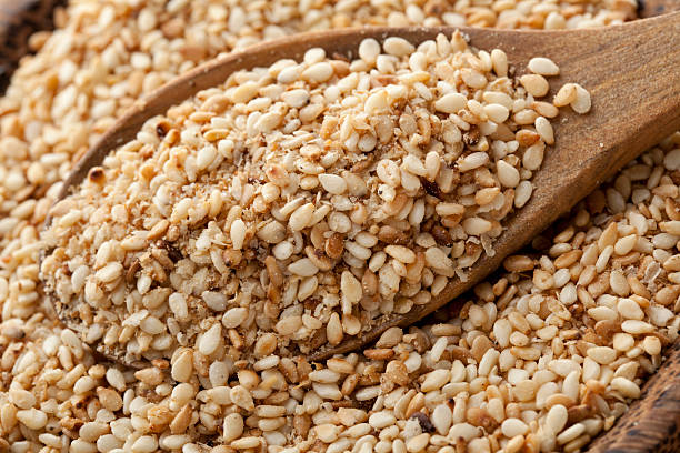 istock Gomasio seeds being scooped by wooden spoon 171305459