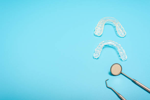 istock Dentist tools to avoid bruxism, arranged on a blue background seen from above. 1713056538