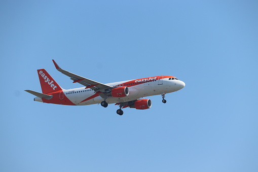 Amsterdam, the Netherlands - September 8th, 2023: G-EZWU easyJet Airbus A320 final approach to Polderbaan runway at Schiphol Amsterdam Airport, the Netherlands