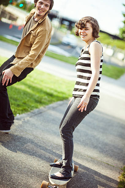istock Couple Riding Skateboards 171305785