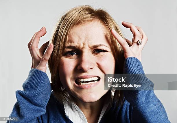 Young Woman Looks Scared And Frustrated Stock Photo - Download Image Now - 20-29 Years, Adult, Adults Only