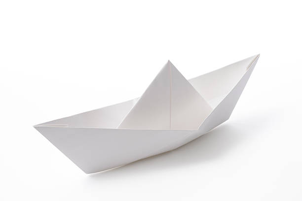 Isolated shot of blank paper boat on white background Blank paper boat isolated on white background with clipping path. toy boat stock pictures, royalty-free photos & images