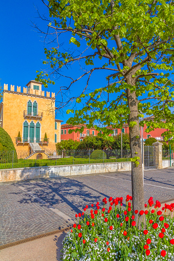 Bardolino is one of the attractive cities on the Veronese shores of Lake Garda. Its promenade is decorated with colorful flowerbeds, plants, wooden benches and walkways and is much frequented in all seasons.