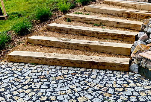 steps from the beams on the terrace by the shore. lined with decorative beds and avenues of linden trees. park improvements near the water surface, a bike path and mooring posts for fishermen's boat