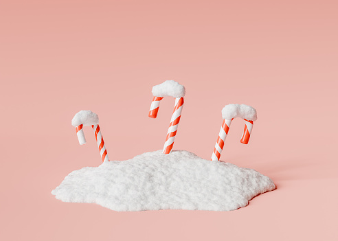 Candy canes on a pile of snow on a red studio background. Christmas, cold and winter concept. 3d rendering