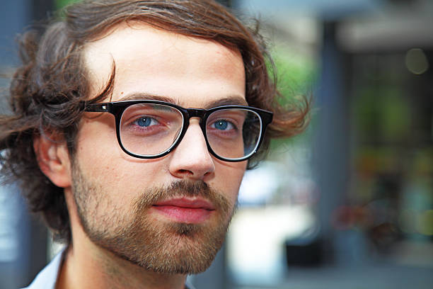 istock head shot of young man with spectacles 171306049