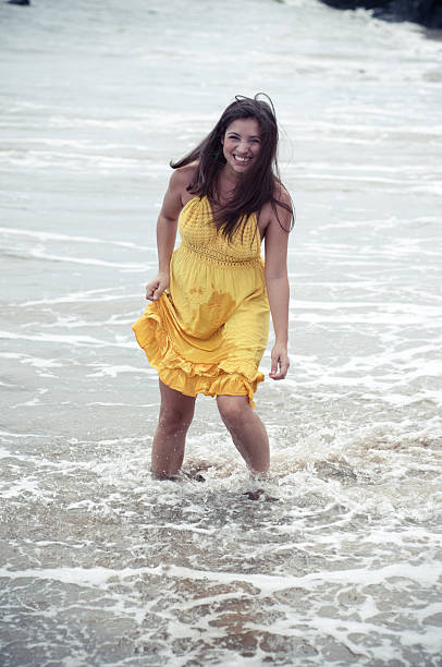 istock Beautiful young woman at the beach 171306120