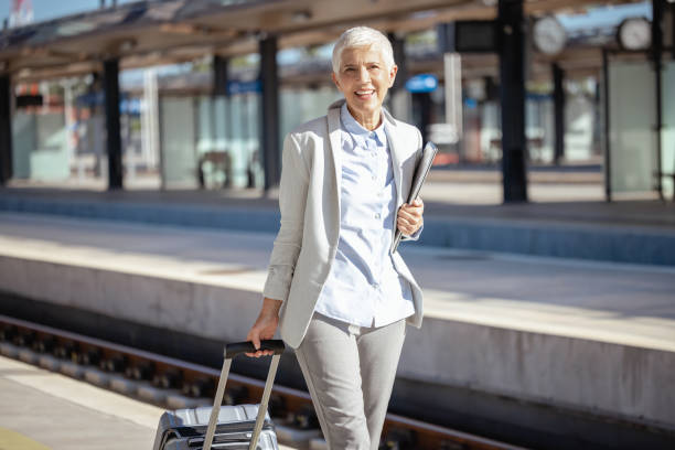 istock Female senior commuter at the train station 1713064976