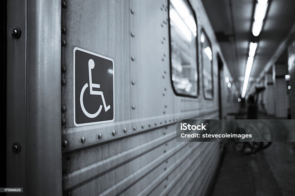 Handicap Empty wheelchair in subway Black And White Stock Photo