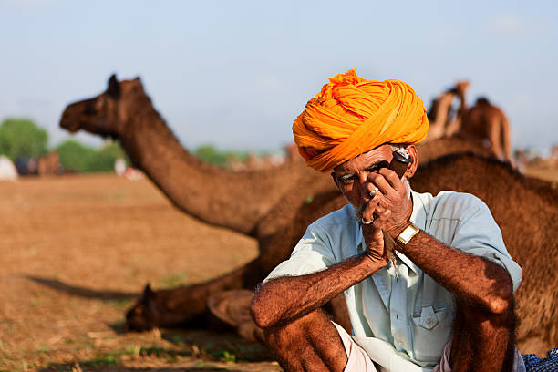 istock Indian men smoking the pipe during festival in Pushkar 171306708