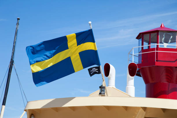 istock Swedish flag and Jolly Roger on vintage lightship 171306941