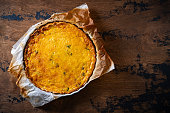 Vegetables quiche homemade on wooden rustic table