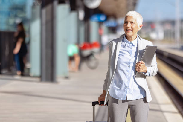 istock Female senior commuter at the train station 1713069824