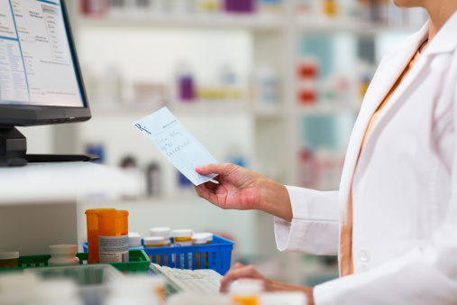 A pharmacists fulfilling a prescription