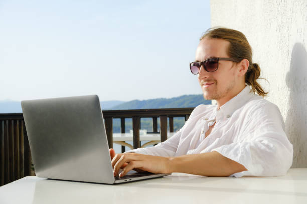 istock Man working on his laptop on the terrace 1713070949