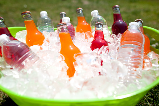 Plastic bottles of assorted carbonated soft drinks in variety of colors