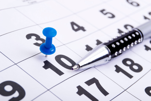 Blue Pin on Calendar with Pen