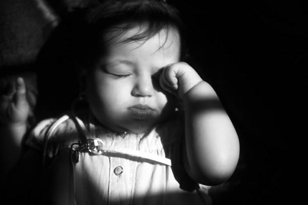 Five year old girl fast asleep, sucking her thumb