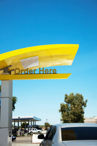 Drive thru fast food restaurant with Order Here sign.See similar image:  1585977