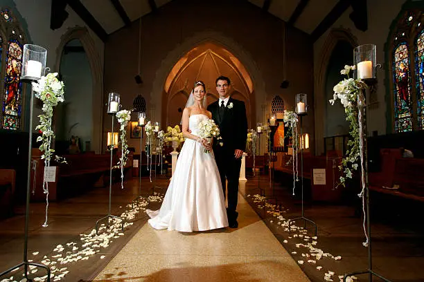 Photo of Wedding Portrait Bride and Groom Couple Inside Old Church Aisle