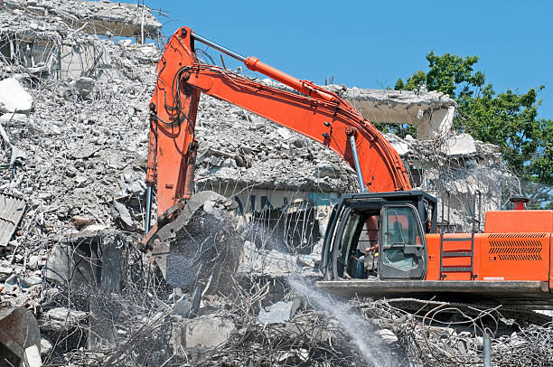 istock Crane clearing debris from building demolition site 171308736