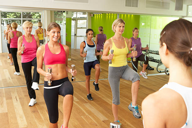 istock Women Taking Part In Gym Fitness Class Using Weights 171308766