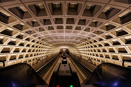 Train and commuters in a Washington DC Metro Station.