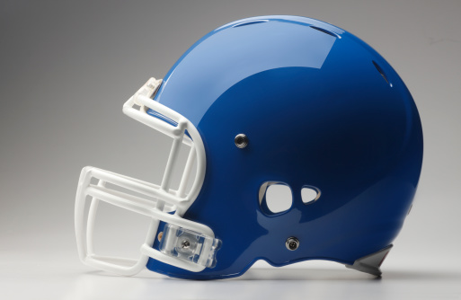 A blue football helmet on a gray background.